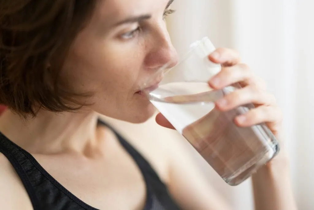 https://unsplash.com/photos/woman-in-black-tank-top-drinking-water-PcU17evKnew?utm_content=creditCopyText&utm_medium=referral&utm_source=unsplash