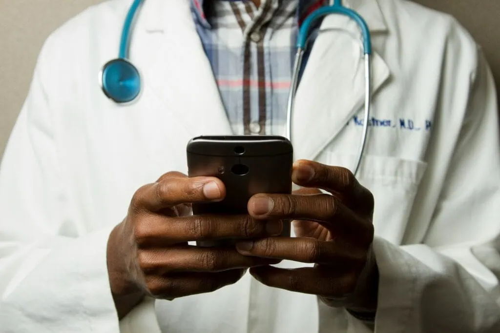 https://unsplash.com/photos/person-wearing-lavatory-gown-with-green-stethoscope-on-neck-using-phone-while-standing-L8tWZT4CcVQ?utm_content=creditCopyText&utm_medium=referral&utm_source=unsplash