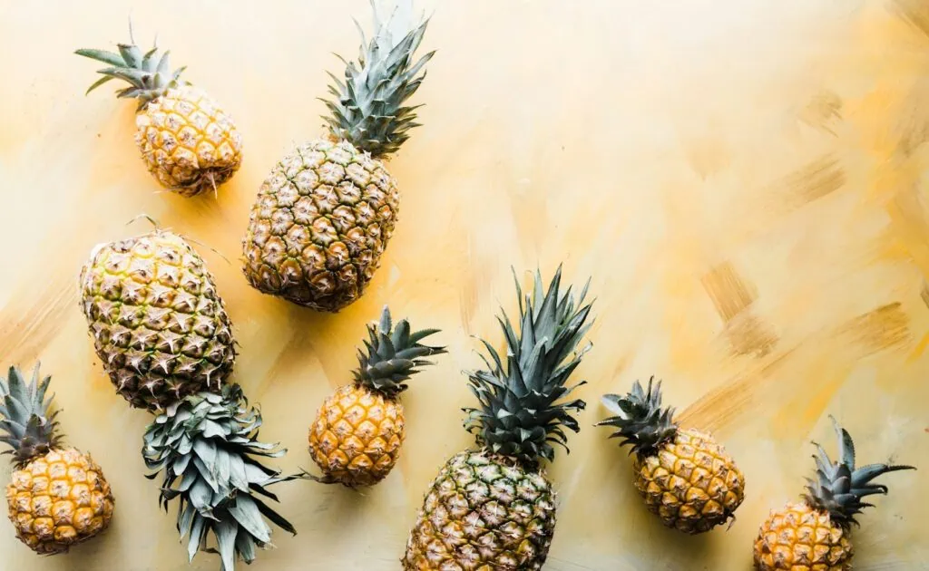 https://unsplash.com/photos/pineapples-on-brown-surface-3A1etBW5cBk?utm_content=creditCopyText&utm_medium=referral&utm_source=unsplash