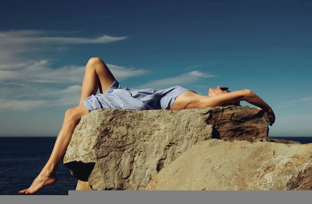 https://unsplash.com/photos/woman-in-blue-denim-shorts-lying-on-brown-rock-during-daytime-9c2M47kYkQ0?utm_content=creditCopyText&utm_medium=referral&utm_source=unsplash
